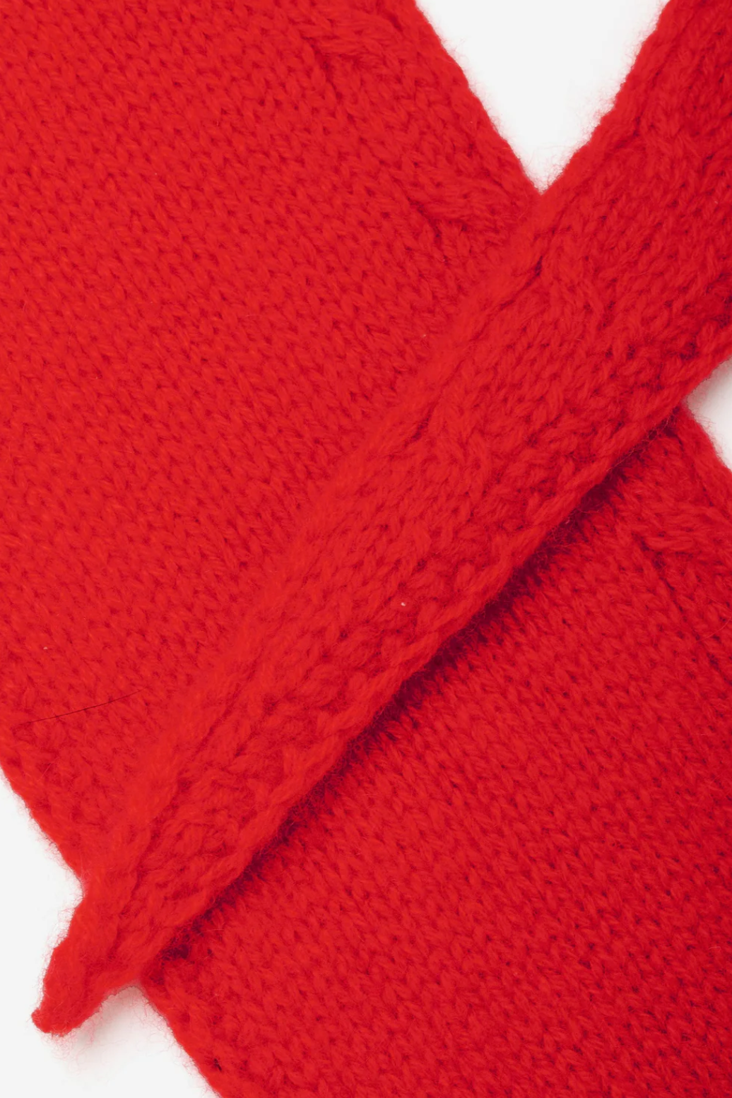 Close-up of a red knitted cashmere on a white background