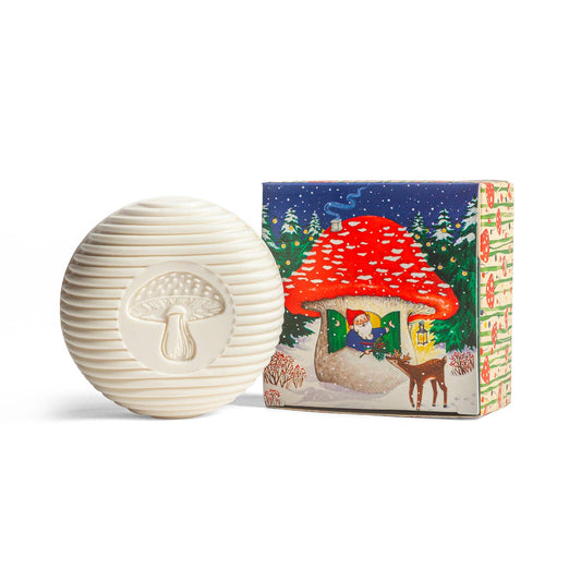 White textured sphere with mushroom design next to a colorful box featuring a fairy tale scene.